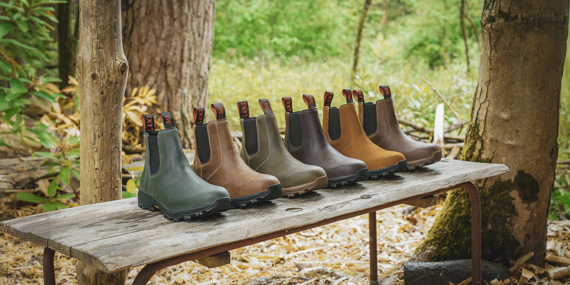 LANX women's, black, navy and grey, lace-to-toe on a wooden shoe rack.