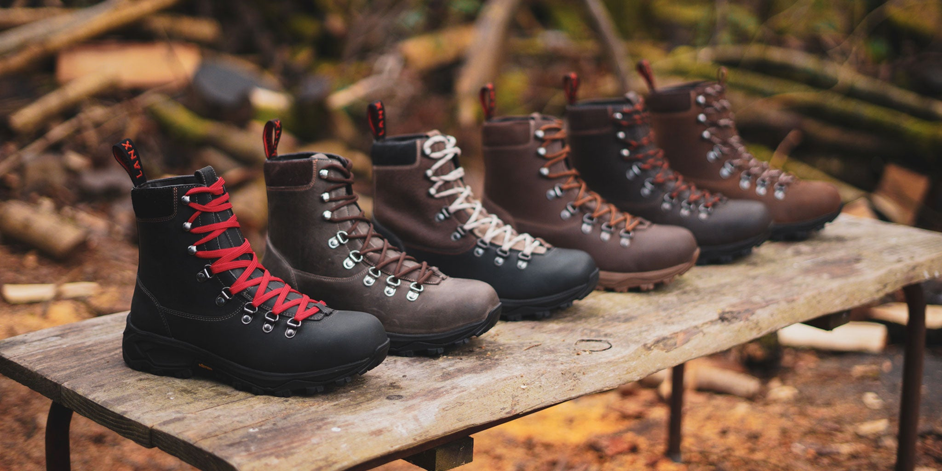 A woman stood on the pavement wearing the Whalley Navy lace-to-toe, hiker style boots.