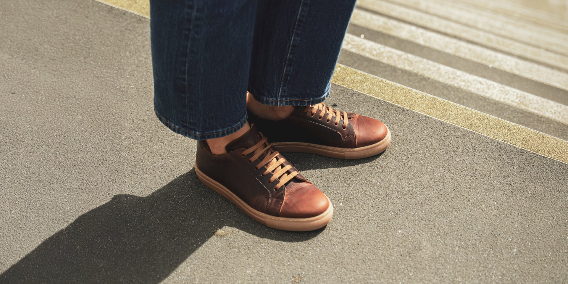 A collection of Cheadle sneakers on a leather backdrop