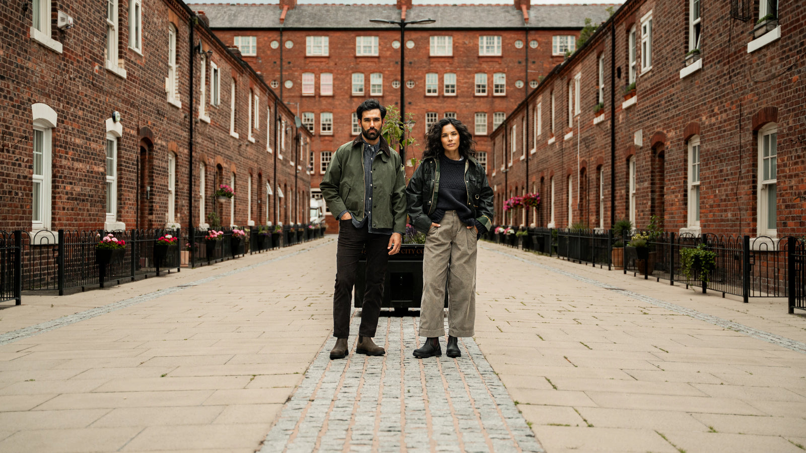 LANX models wearing AXIS footwear on a brick-lined street